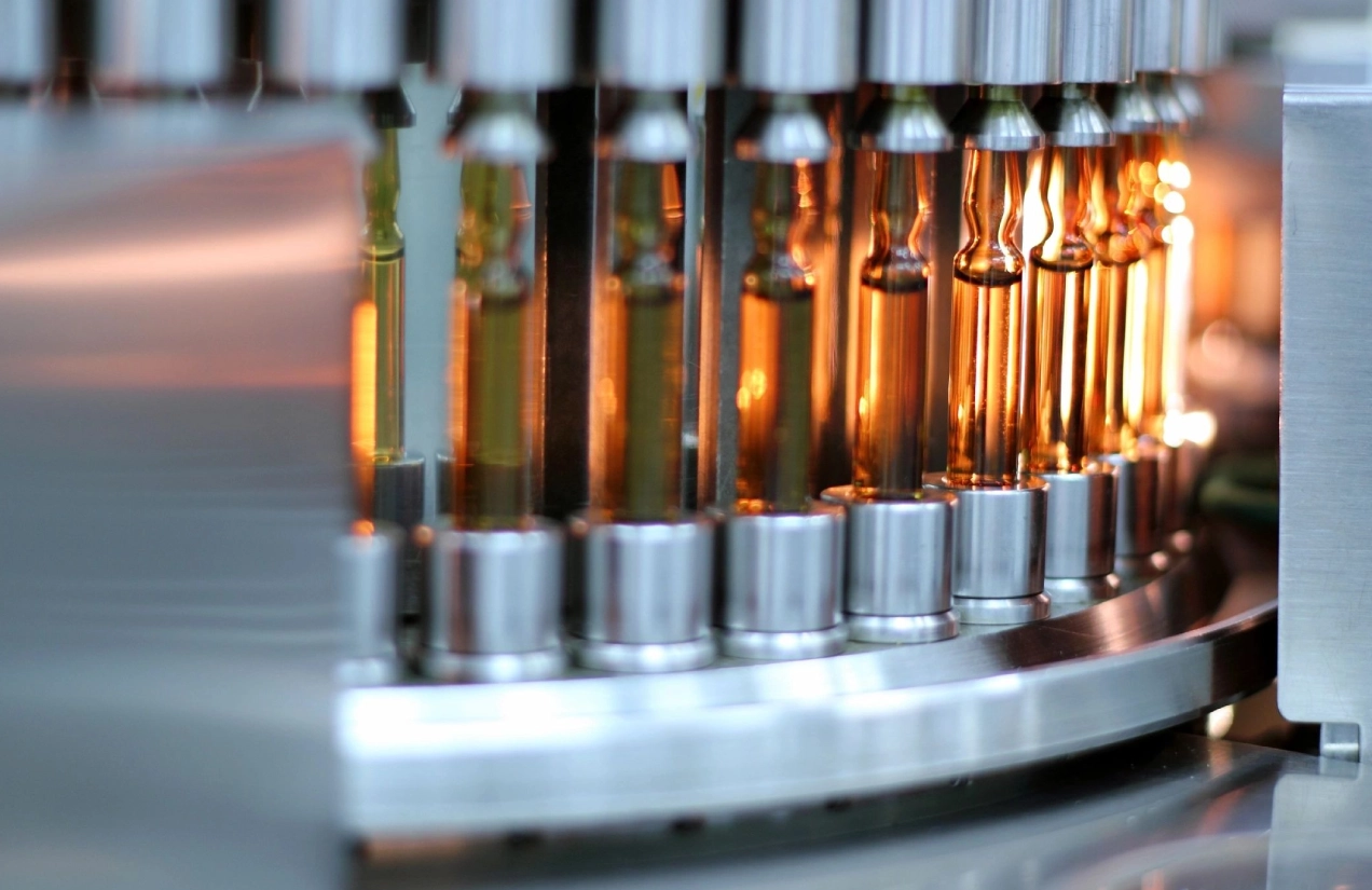 A close up of many bottles on the assembly line